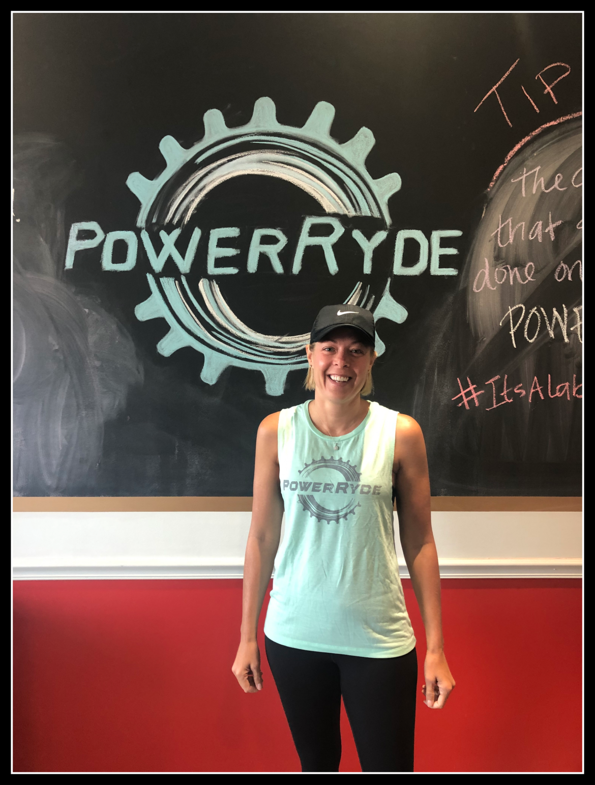 Kim Dippold in front of chalk PoweRyde logo